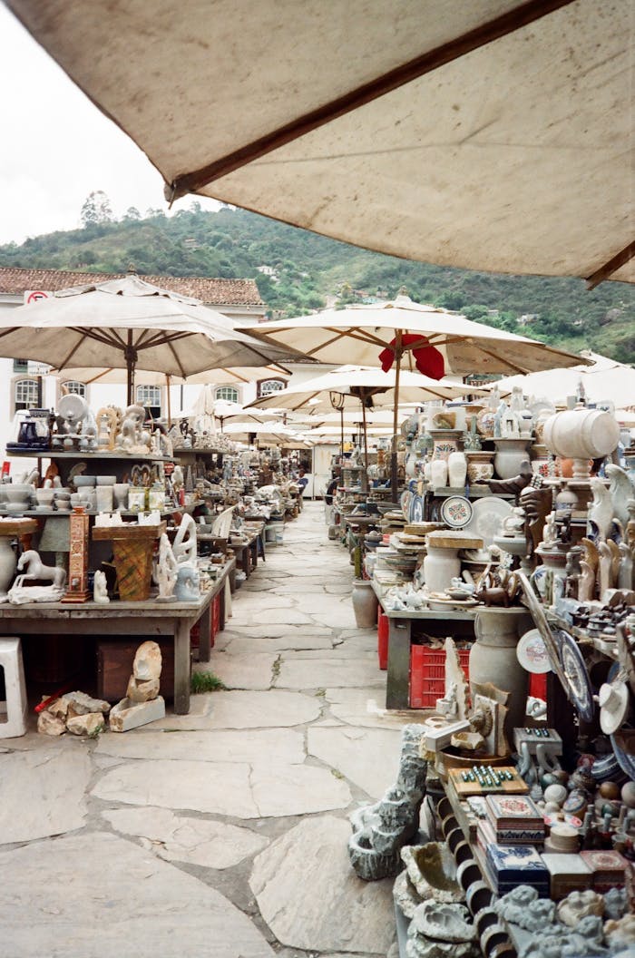 Explore diverse ceramics in Ouro Preto's vibrant outdoor market.